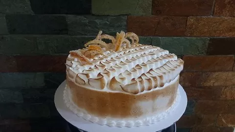 Simple yet elegant cake with layers of Vanilla Sponge and Lemon Curd finished with torched Swiss Meringue!